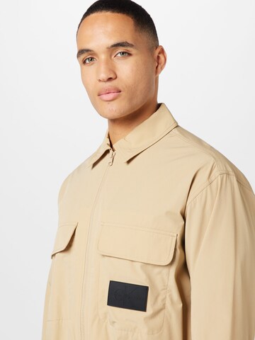 Calvin Klein Jeans Between-season jacket 'ESSENTIAL' in Beige