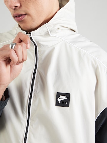 Nike Sportswear Tussenjas 'AIR' in Grijs