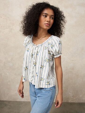 Next Blus i grå: framsida