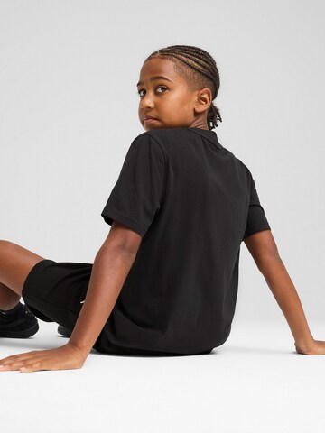 PUMA T-shirt 'WARDROBE ESS' i svart