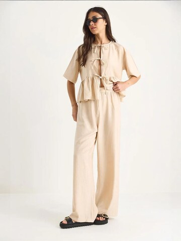 Bianco Lucci - Calças de fato em bege