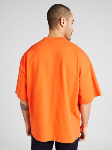 Pegador - Camiseta 'ZERO' en naranja