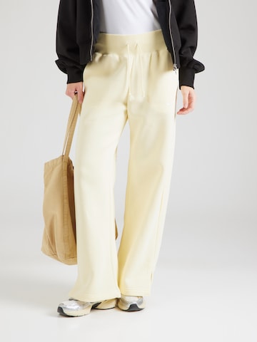 Wide Leg Pantalon de sport 'Phoenix' NIKE en jaune : devant