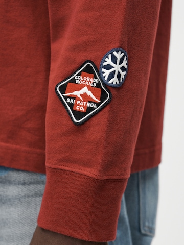 Tricou de la Abercrombie & Fitch pe roșu