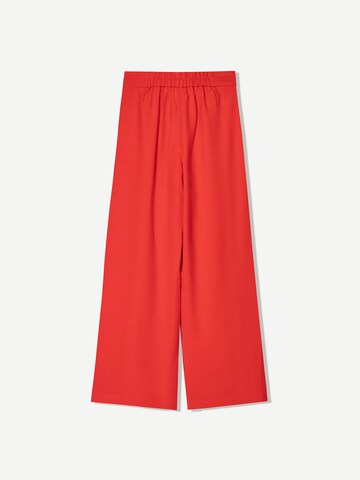 Wide leg Pantaloni con pieghe di Bershka in rosso