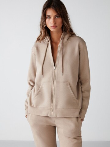 Veste de survêtement Grimelange en marron : devant