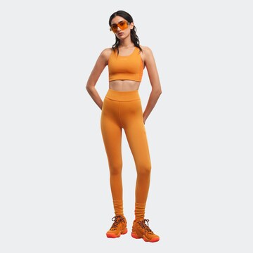 ADIDAS PERFORMANCE Skinny Workout Pants 'Adidas x Ivy Park' in Orange: front