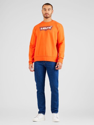 LEVI'S ® Collegepaita 'Standard Graphic Crew' värissä oranssi