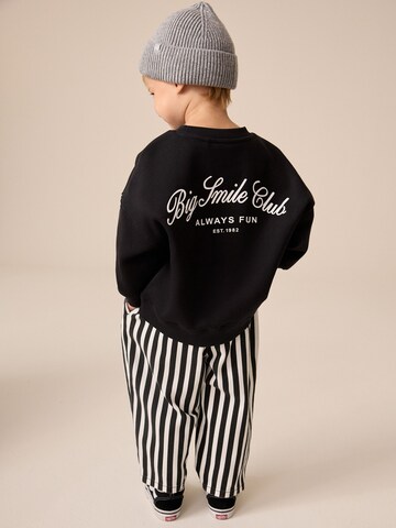 Next - Conjunto en negro: frente