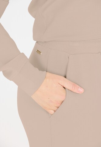 Athlecia Regular Sporthose 'Jacey' in Braun