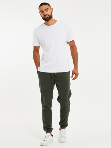 Tapered Pantaloni di Threadbare in verde