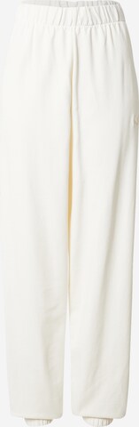 PUMA - Tapered Pantalón deportivo en beige: frente