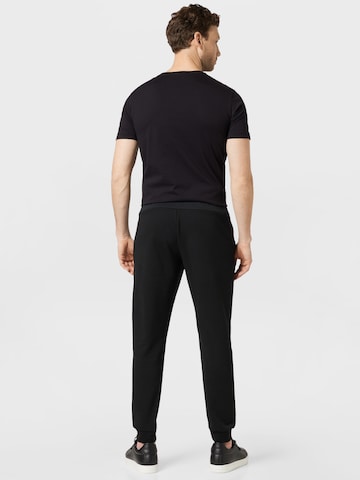 Effilé Pantalon de sport Lacoste Sport en noir