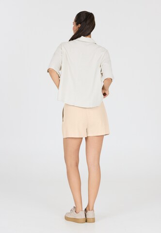Athlecia Loose fit Sports trousers 'Resort' in Brown
