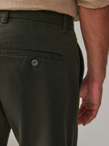 Slimfit Pantaloni chino di Next in verde