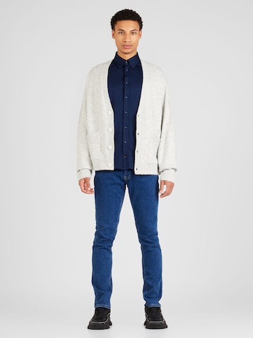 Vestes en maille Tommy Jeans en blanc