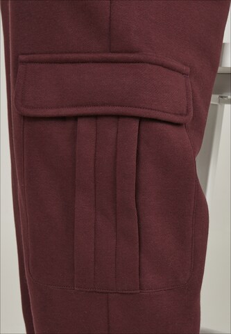 Effilé Pantalon cargo Urban Classics en rouge