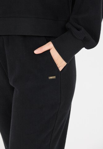 Athlecia Regular Sports trousers in Black