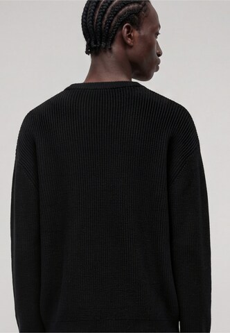 Pull-over Karl Kani en noir