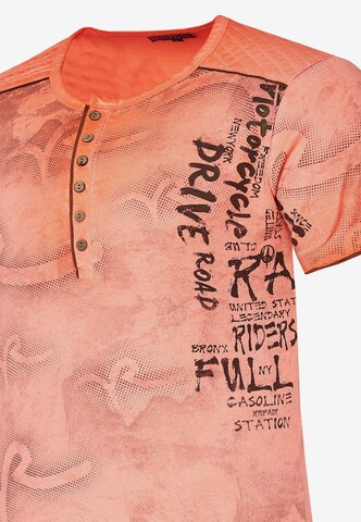 Rusty Neal T-Shirt mit lässigem Allover-Print in Orange