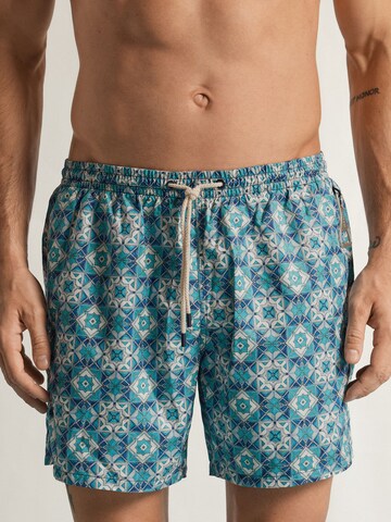IUMAN Intimissimi Board Shorts in Blue: front