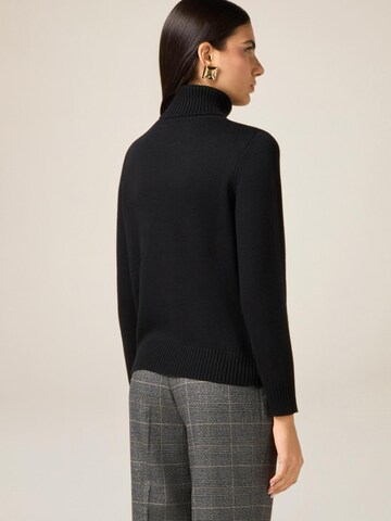 Pullover di oltre in nero