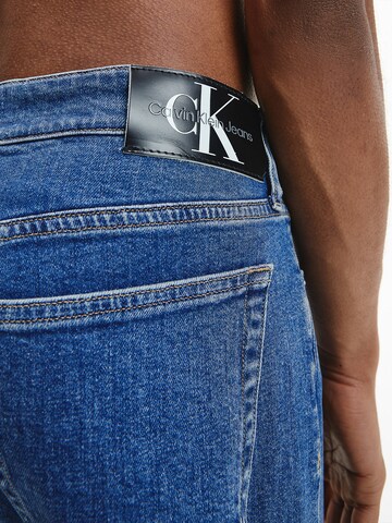 Calvin Klein Jeans Tapered Jeans in Blauw