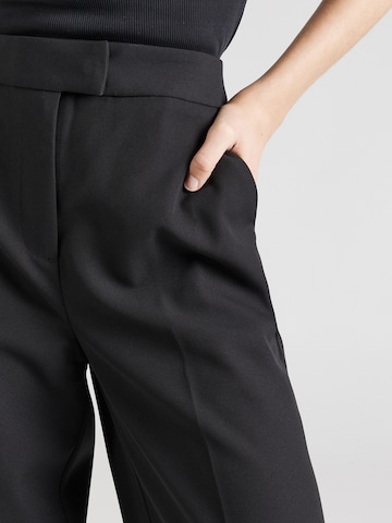 ABOUT YOU x Iconic by Tatiana Kucharova Wide leg Trousers with creases 'Vicky' in Black