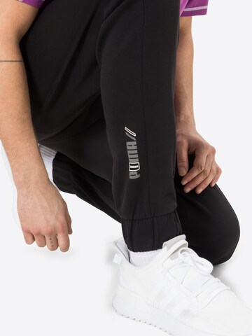 PUMA Zúžený Sportovní kalhoty 'Radical' – černá
