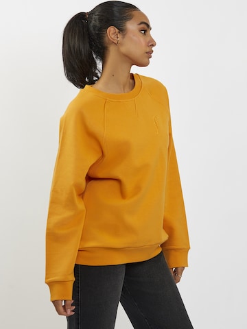 FRESHLIONS Oversized Sweater in Orange