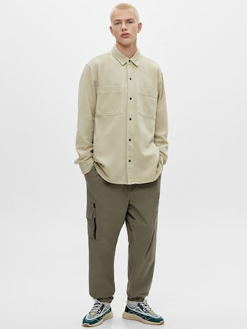 Pull&Bear Loose fit Cargo trousers in Green: front