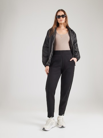 Tapered Pantaloni 'NEW VICTOIRE' di GUESS in nero