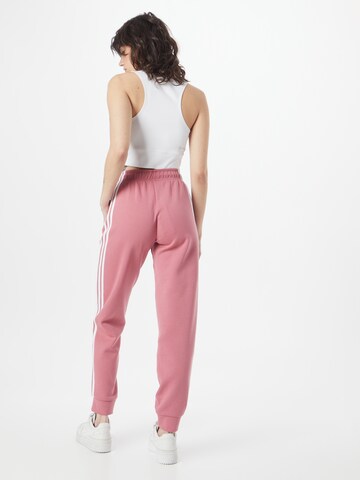 ADIDAS SPORTSWEAR - Tapered Calças de desporto 'Future Icons 3-Stripes ' em rosa