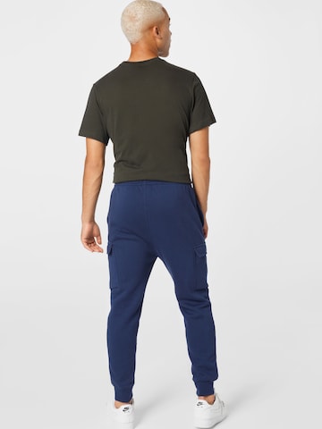 Nike Sportswear Tapered Gargohousut 'Club' värissä sininen