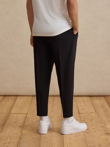 DAN FOX APPAREL Regular Pleat-Front Pants 'Toni' in Black