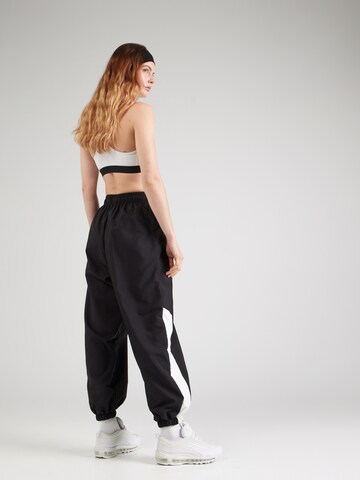 Nike Sportswear Tapered Trousers in Black