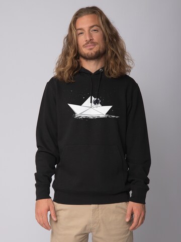 Watapparel Sweatshirt ' Astronaut in paper boat ' in Zwart: voorkant