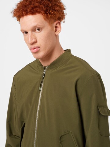 Revolution Between-season jacket in Green