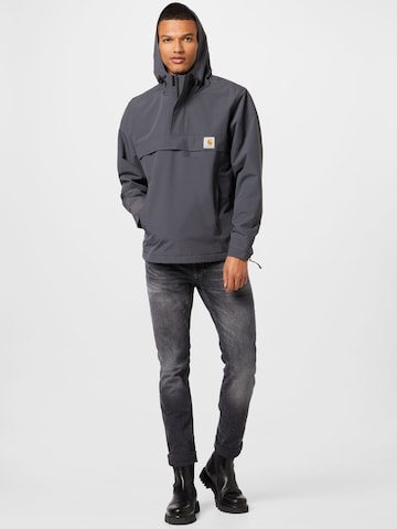 Carhartt WIP Regular fit Prehodna jakna 'Nimbus' | siva barva