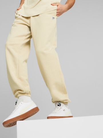 PUMA Tapered Trousers in Beige: front