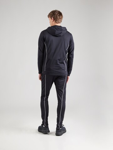 Completo per l'allenamento 'Novelty' di UNDER ARMOUR in nero