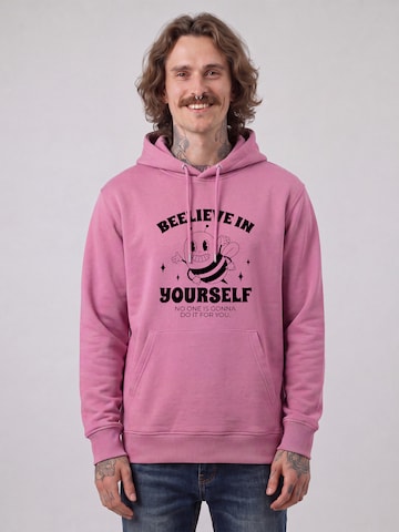 Felpa ' Beelieve in yourself ' di Watapparel in rosa: frontale