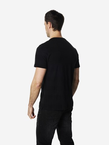 Tricou de la KOROSHI pe negru