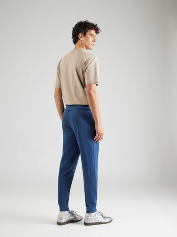 ELLESSE Tapered Pants 'Bertoni' in Blue