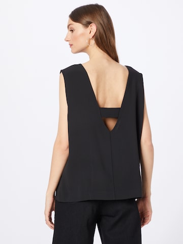 Top 'TRAVEL' di Calvin Klein in nero