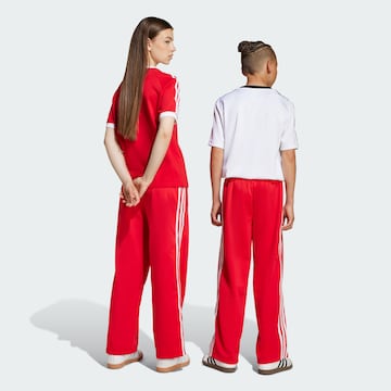 ADIDAS ORIGINALS Loose fit Trousers 'Adicolor Firebird' in Red