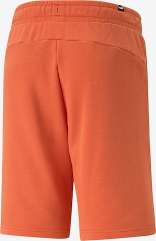 PUMA - Regular Calças de desporto em laranja