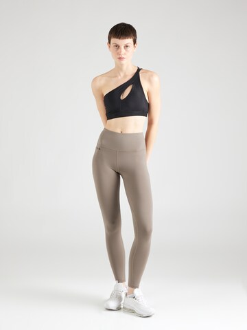 Skinny Pantalon de sport 'Motion' UNDER ARMOUR en gris