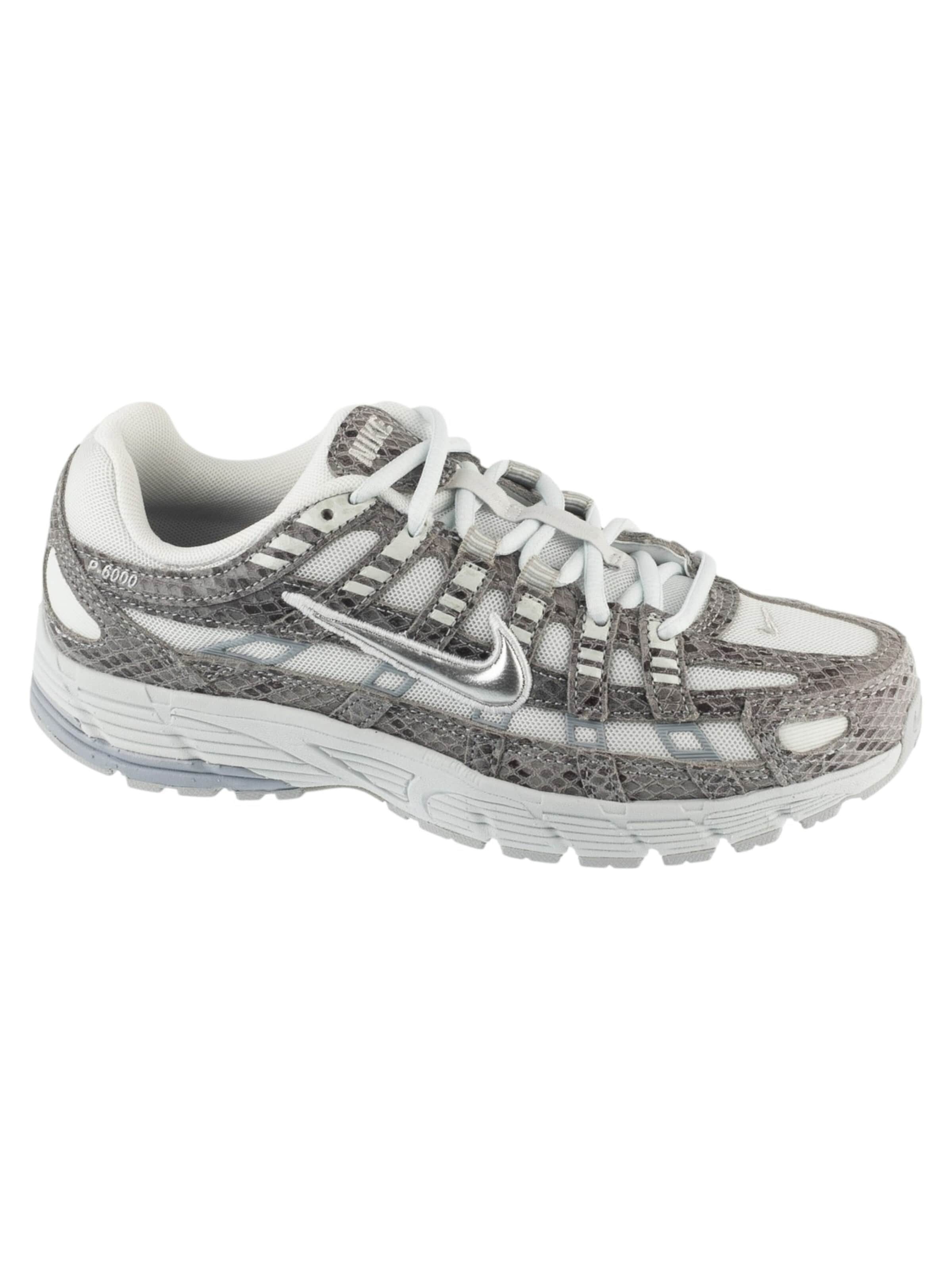NIKE Sneakers in White: front