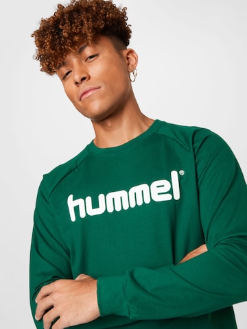 Hummel Urheilullinen collegepaita värissä vihreä